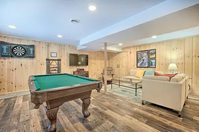 a living room with a pool table and a couch at Relaxing Home Mins from Mt Snow, Hiking, and Lakes in Dover
