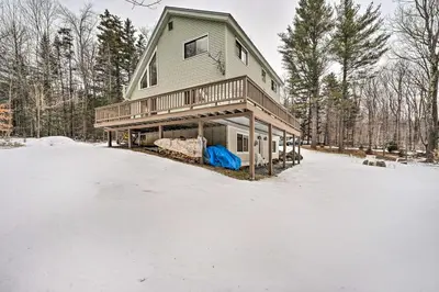 a house in the snow with a snow covered yard at Relaxing Home Mins from Mt Snow, Hiking, and Lakes in Dover