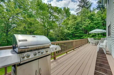 a grill on the deck of a house at Relaxing Home Mins from Mt Snow, Hiking, and Lakes in Dover