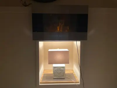 a lamp in a room with a tv on a wall at California guest house in Greenwich