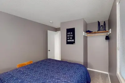a bedroom with a bed and a sign on the wall at Glorious Scenery in Dover