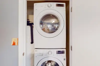 a washing machine and a washer in a room at Glorious Scenery in Dover