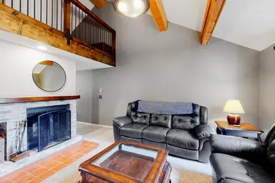 a living room with a couch and a fireplace at Glorious Scenery in Dover