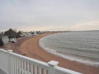 a view of a beach with houses and the ocean at Casa al Mare Beachfront Retreat King Bed Near Yale in East Haven