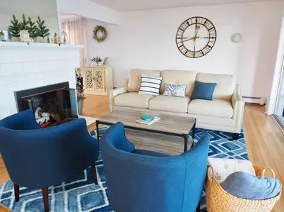 a living room with a couch and chairs and a table at Casa al Mare Beachfront Retreat King Bed Near Yale in East Haven