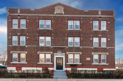 a large red brick building with a door at The Elizabeth Suite B2 in Hartford