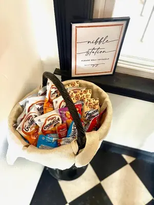 a basket full of candy in front of a window at The Elizabeth Suite B2 in Hartford