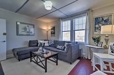 a living room with a couch and a table at The Traveler Suite C1 in Hartford