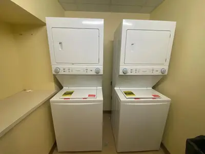 two white refrigerators sitting next to each other in a room at Slopeside Ski-In/Ski-Out ; HotTub ; 2 Room 2 Bath in Hunter
