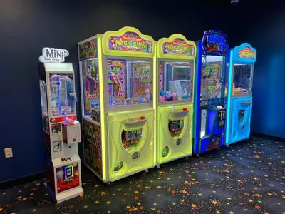 four arcade games are lined up against a wall at Slopeside Ski-In/Ski-Out ; HotTub ; 2 Room 2 Bath in Hunter