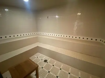 a empty room with a table and a tiled floor at Slopeside Ski-In/Ski-Out ; HotTub ; 2 Room 2 Bath in Hunter