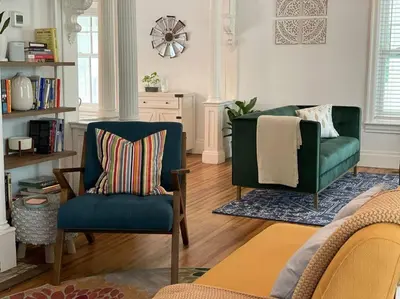 a living room with two chairs and a couch at 1850 Catskills Farmhouse on 8 acres in E. Durham in East Durham