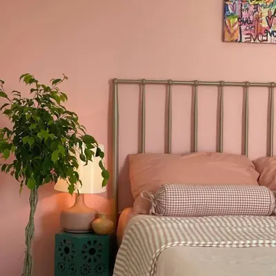 a bedroom with a bed and a potted plant at 1850 Catskills Farmhouse on 8 acres in E. Durham in East Durham