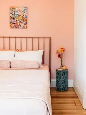 a bedroom with a bed and a vase with flowers at 1850 Catskills Farmhouse on 8 acres in E. Durham in East Durham