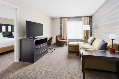 a hotel room with a couch and a television at Residence Inn by Marriott New Haven Hamden in Hamden