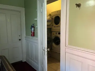 a laundry room with a washer and dryer at 1 Br Private Victorian Apt in convenient City location on half acre sleeps 4 in Poughkeepsie