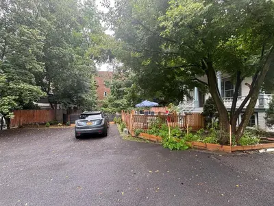 a car parked in a driveway in front of a house at 1 Br Private Victorian Apt in convenient City location on half acre sleeps 4 in Poughkeepsie