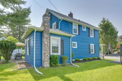 a blue house on a street at Bright Cornwall-On-Hudson Vacation Rental! in Cornwall-on-Hudson