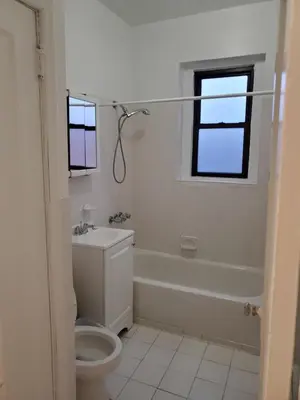 a bathroom with a toilet and a tub and a sink at Comfy stay – sleeps 4 (Hoboken) in Hoboken