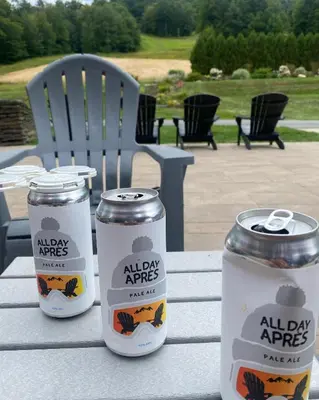 three canisters sitting on a table on a patio at The Brookside Lodge & Cottage in Dover