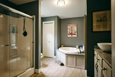 a bathroom with a tub and a sink and a shower at Bear House Catskills - Private Pool, Pond, Hot Tub, Work-Friendly in Cairo