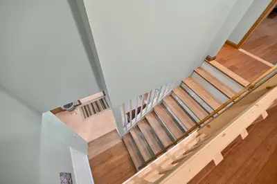 an overhead view of a staircase with wooden floors at Poconos Peaceful Retreat - Families & Large Groups in Tobyhanna