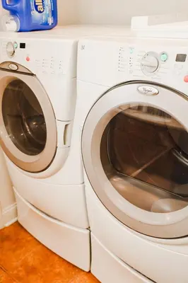 a white washer and dryer sitting next to each other at NEWLY REMODELED FOUR BEDROOM All SEASON CONDO W MOUNTAIN VIEWS in East Jewett