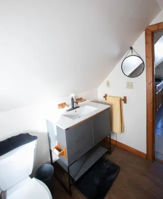 a bathroom with a sink and a toilet at Cozy Tiny Haus Apt in Torrington