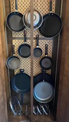 a bunch of pots and pans on a wall at Spacious Gateway, Walk to POOL & BEACH, Hot tub, Game room in Pocono Country Place