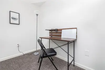 a desk in a room with a chair at Exquisite Downtown Loft Apartment in Hartford