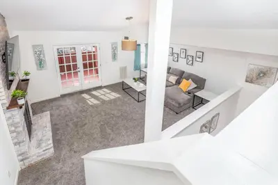an aerial view of a living room with a couch at Exquisite Downtown Loft Apartment in Hartford