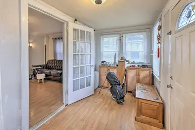a living room with a stroller in the middle of a room at Charming New York Escape Near Central Park! in Jericho