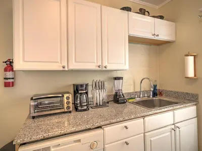 a kitchen counter with a microwave and a sink at 1st Base Apt 2 All Star Baseball Rentals in Oneonta