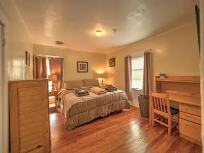a bedroom with a bed and a desk in it at 1st Base Apt 2 All Star Baseball Rentals in Oneonta