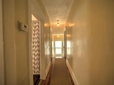 an empty hallway with a window and a door at 1st Base Apt 2 All Star Baseball Rentals in Oneonta