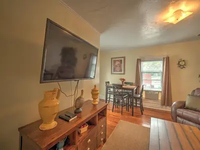 a living room with a large flat screen tv on the wall at 1st Base Apt 2 All Star Baseball Rentals in Oneonta