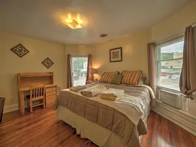 a bedroom with a bed and a desk in it at 1st Base Apt 2 All Star Baseball Rentals in Oneonta