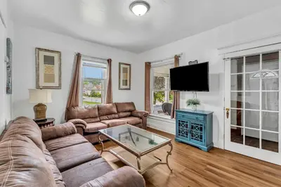 a living room with a couch and a tv at 2nd Base Apt 1 All Star Baseball Rentals in Oneonta