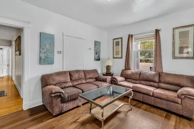 a living room with a couch and a table at 2nd Base Apt 1 All Star Baseball Rentals in Oneonta