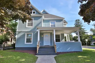 a blue house with a white door and stairs at 2nd Base Apt 1 All Star Baseball Rentals in Oneonta
