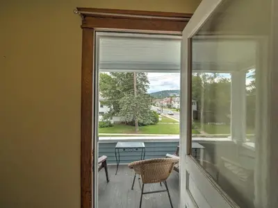 a screened in porch with a window and a table at 2nd Base Apt 2 All Star Baseball Rentals in Oneonta