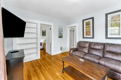 a living room with a couch and a tv at 2nd Base Apt 2 All Star Baseball Rentals in Oneonta