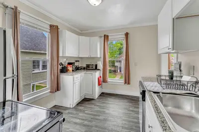 a kitchen with white cabinets and white appliances at 2nd Base Apt 2 All Star Baseball Rentals in Oneonta