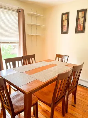 a dining room table and chairs in a room at After the Game Apt 1 All Star Baseball Rentals in Oneonta
