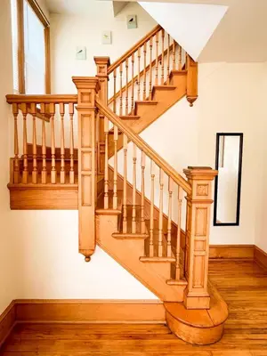 a wooden staircase in a home with wooden floors at After the Game Apt 1 All Star Baseball Rentals in Oneonta