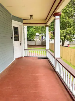 a front porch of a house with a white door at After the Game Apt 2 All Star Baseball Rentals in Oneonta