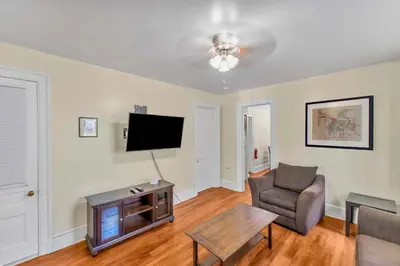 a living room with a couch and a tv at After the Game Apt 2 All Star Baseball Rentals in Oneonta