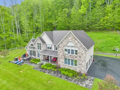 an aerial view of a house at Grand Slam Lake House Cooperstown Dreams Park in Cooperstown