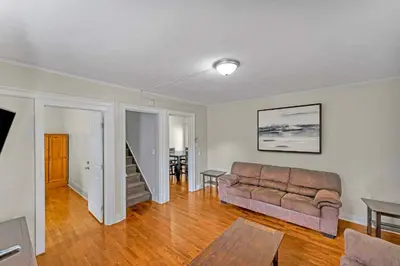 a living room with a couch and a table at Right Field All Star Baseball Rentals in Oneonta