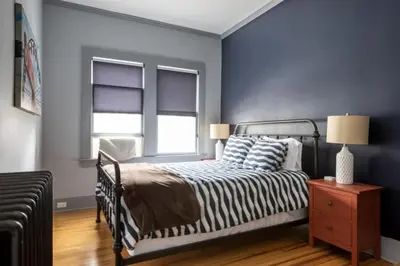 a bedroom with a zebra print bed and a window at Hudson Valley Retreat in Downtown Hudson, NY - Sleeps 16-20 in Hudson
